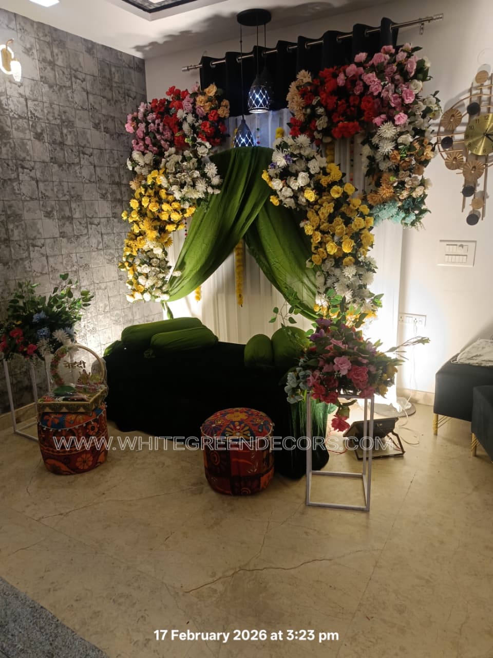 Elegant Green Mehndi Decoration Setup with Floral Arch